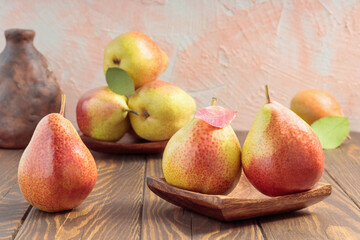 Still life with fresh pears on wooden table. Selective focus.