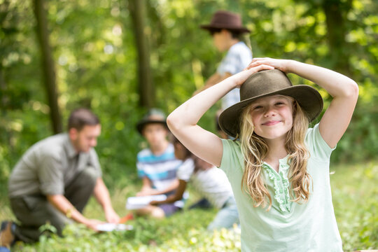 Little girl scout win the forest with her group, portrait