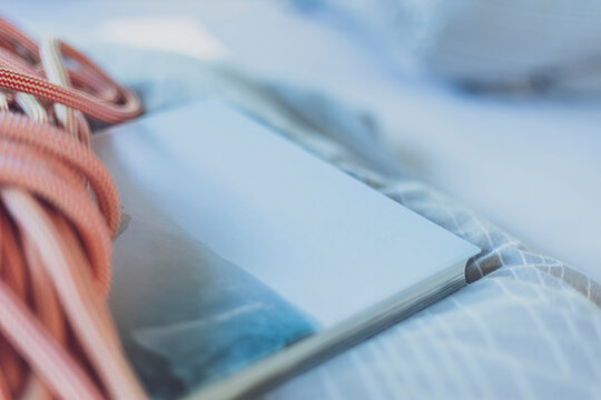 Close-up of climbing rope and book on mattress