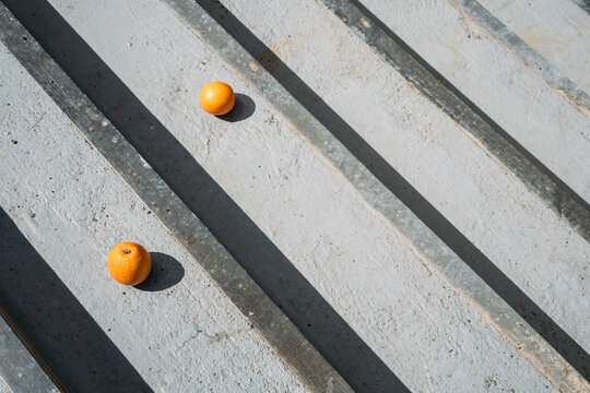 Oranges on gray wood boards