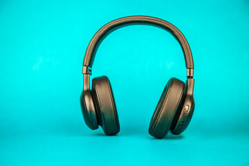 Wireless Headset isolated over emerald blue Background
