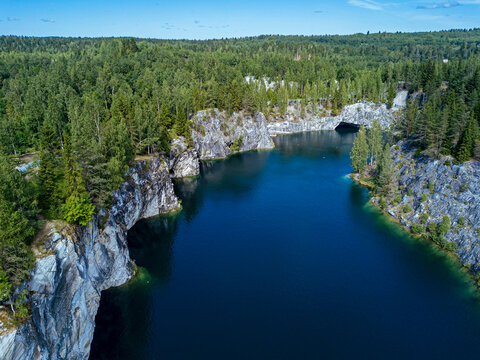 Russia, Republic of Karelia, Sortavala, Aerial view of green forest surrounding Marble Lake in summer