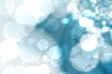 Abstract blurred festive delicate winter christmas or Happy New Year background with shiny blue and white bokeh lighted stars. Space for your design. Card concept.