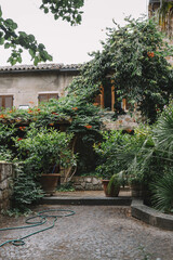 Fototapeta na wymiar Beautiful typical italian countryhouse and green yard in a little old town in Italy