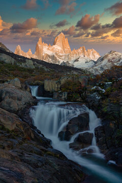 Mount Fitz Roy and waterfall at sunrise in Autumn, El Chalten, Patagonia, Argentina