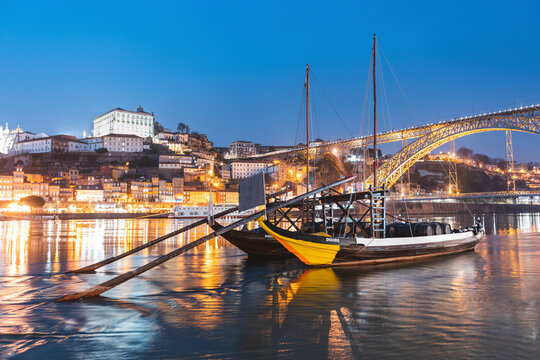 Portugal, Porto District,&Ocirc;&oslash;&Omega;Porto, Rabelo boats moored on Douro river at dusk