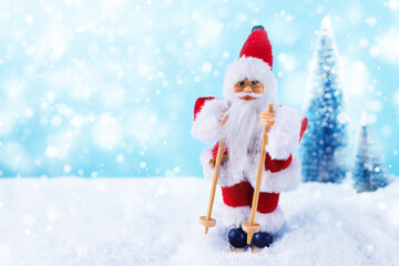 Christmas background with Samta Claus on ski in a winter landscape. Christmas greeting card. Winter time.