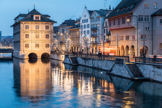 Switzerland, Zurich, Rathaus and Limmat river at dusk
