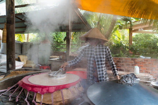 Woman producing noodles at home, Ho Chi Minh, Vietnam