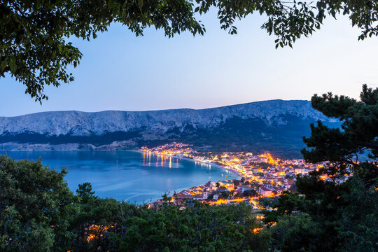 Aerial view of houses by sea against clear sky in Baska at sunset, Krk Island, Croatia