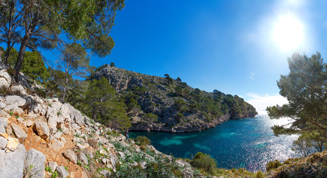 Spain, Balearic Islands, Mallorca, Peninsula Formentor, Cala en Gossalba, hiker looking at distance