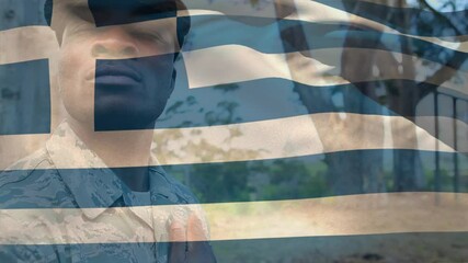 Animation of flag of greece over african american male soldier - Powered by Adobe