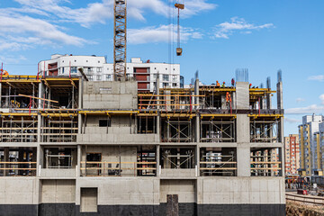 Construction of a monolithic reinforced concrete house. Modern building technologies. Construction of a modern multi-storey building.