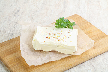 Greek Feta cheese over board