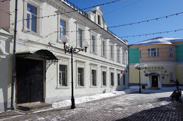 Vladimir, Russia - March, 2021: Ancient city street in winter sunny day.