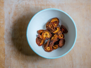 Dried apricots on white plate