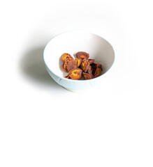 Dried apricots on white plate