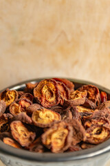 Dried apricots in rustic dark plate