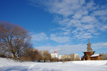 MOSCOW, RUSSIA - February, 2021: Winter day.  Wooden gate-tower of St Nicholas Monastery from Karelia, now at the Kolomenskoe museum
