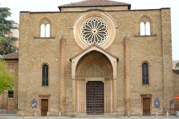 Fototapeta premium Windows to the sky. Windows on medieval church sky.Romanesque church of San Francesco with a terracotta brick facade. 