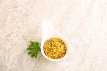 Grain mustard sauce in the bowl