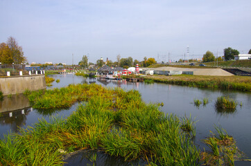 Fototapeta premium Tula, Russia - October 2020: Kazanskaya embankment near the Tula Kremlin with a view of the canal in an autumn day