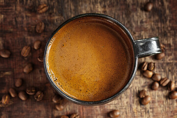 Coffee espresso in cup with coffee beans