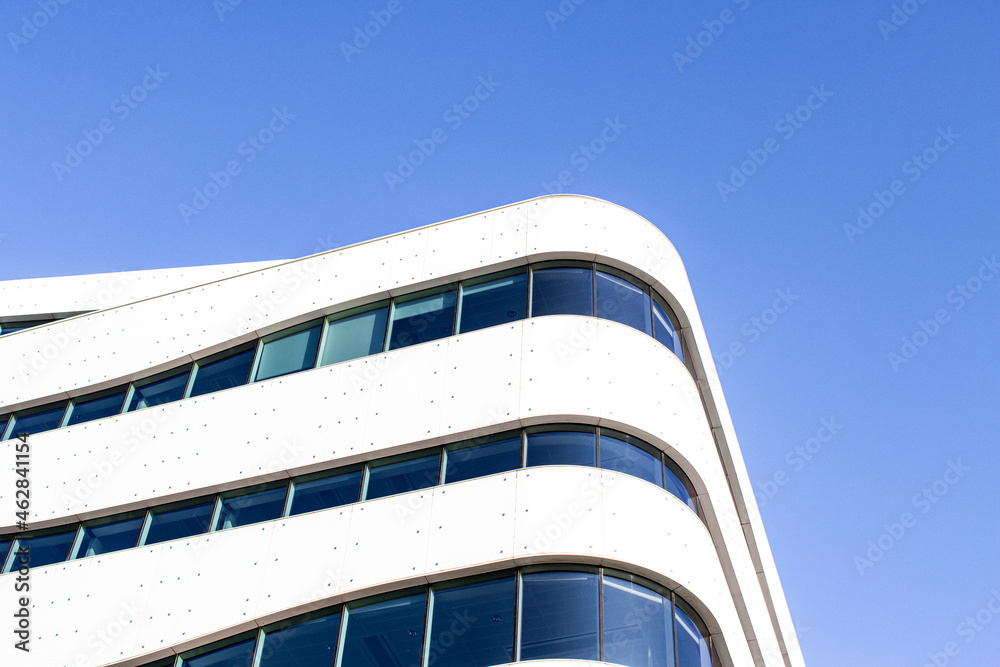 Wall mural contemporary building architecture background with sky and copyspace. geometric shapes and modern ba