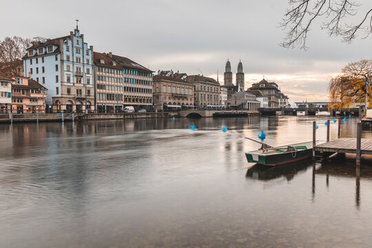 Switzerland, Zurich, City with Limmat river, houses on riverfront and bell towers in background
