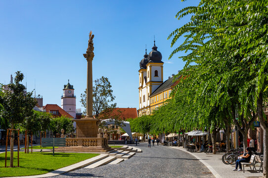Slovakia, Trencin, Peace Square with Plague Pillar and Church of Saint Francis Xavier in Trencin in background