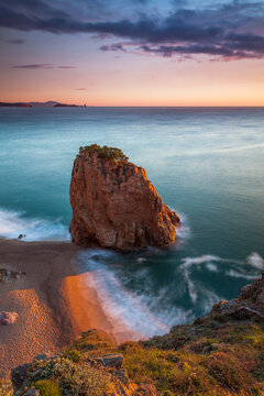 Spain, Girona, Begur, Coastal stack rock at dawn