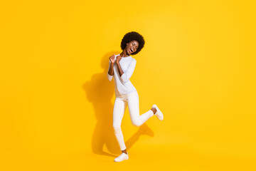 Fototapeta na wymiar Full body photo of positive dark skin person closed eyes open mouth partying isolated on yellow color background
