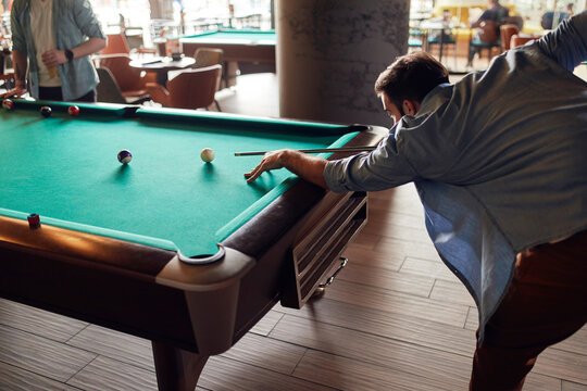 Man playing billiards