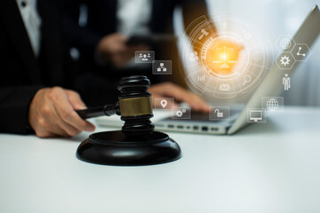 Concepts of Law and Legal services. Lawyer working with law interface icons. Blurred background.	