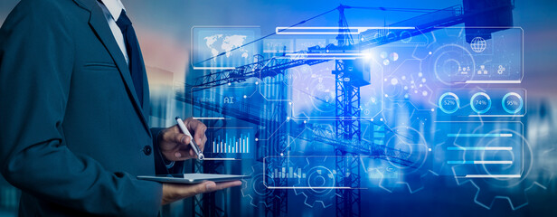 Future building construction engineering and technology project concept. double exposure graphic with engineer using digital tablet and smart industry and IOT software to control operation.