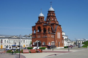 Fototapeta na wymiar Vladimir, Russia - May, 2021: Ancient city street in spring sunny day. Trinity Church