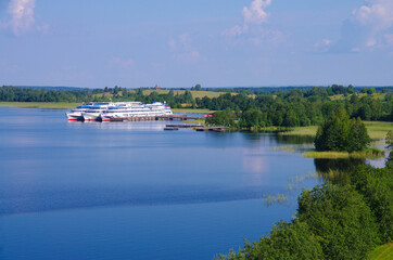 Kizhi, Karelia, Russia - July, 2021: View of Lake Onega and the pier with a motor ship on the Kizhi island