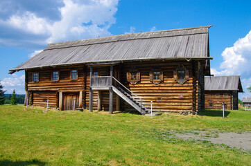 Fototapeta na wymiar Kizhi, Karelia, Russia - July, 2021: Traditional northern wooden houses on the territory of the Kizhi Museum