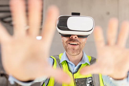 Architect with VR glasses at construction site