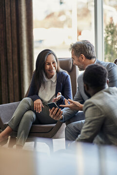 Business people having a meeting in hotel lobby