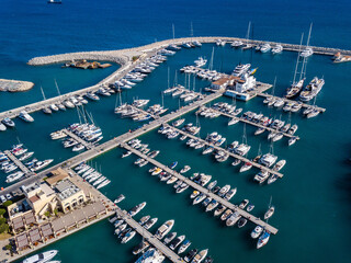 Aerial shot from drone of marina port with yachts and sailboats