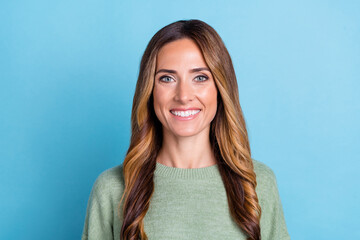 Photo portrait woman wearing green sweater smiling cheerful isolated pastel blue color background