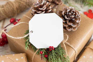 Christmas present with blank gift tag close up, Mockup