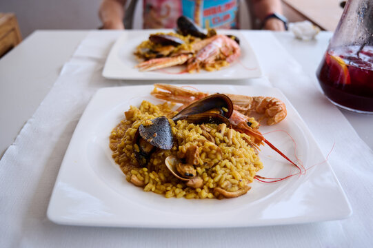 Paella Traditional, Seafood paella in the fry pan with mussels, king prawns, langoustine and squids