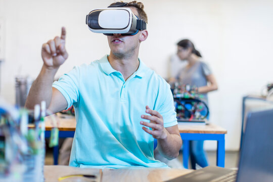 Technician using a VR headset in workshop