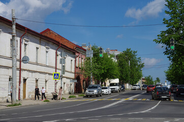 Fototapeta premium Rybinsk, Russia - May, 2021: View of the street of the city. Chkalov street
