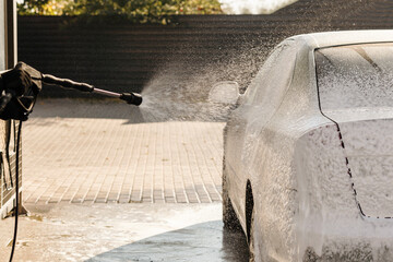 Car Wash with foam soap Outdoor.  Washing Car.