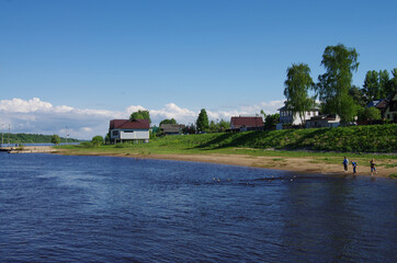 Fototapeta na wymiar Tutaev, Russia - May, 2021: Volga river and a view of Borisoglebskaya side of Tutaev