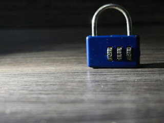 Fototapeta premium combination lock on a wooden background