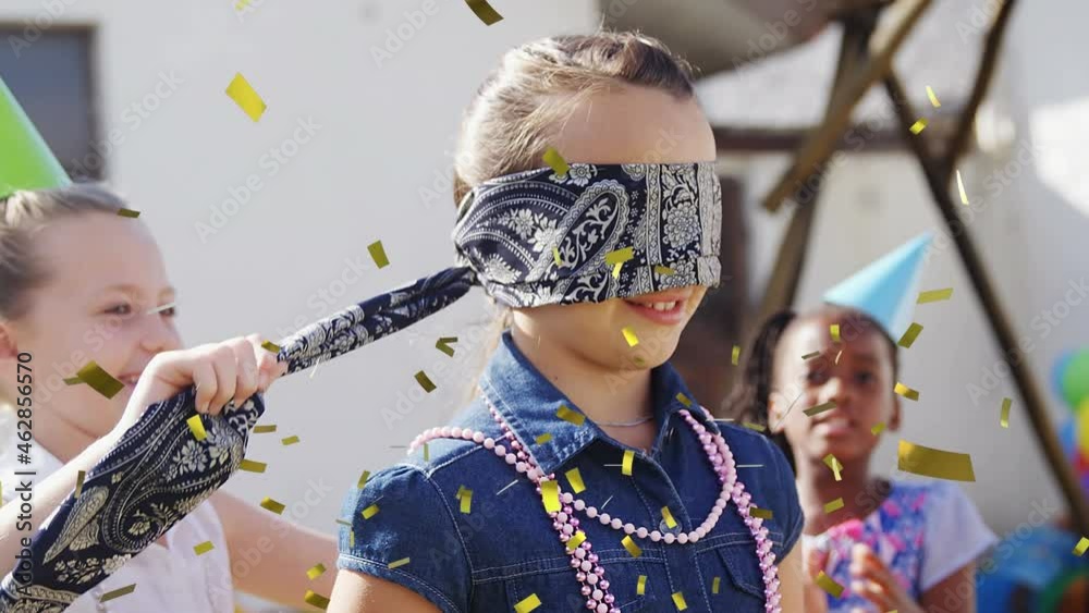 Canvas Prints Animation of confetti falling over children playing hide and seek at children's party